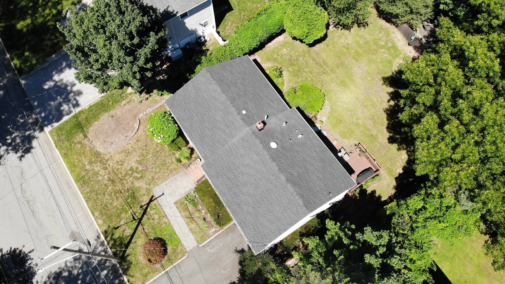 A finished architectural shingle system. On Morris County jobs we carry the ice-and-water shield further up the deck than code asks for.