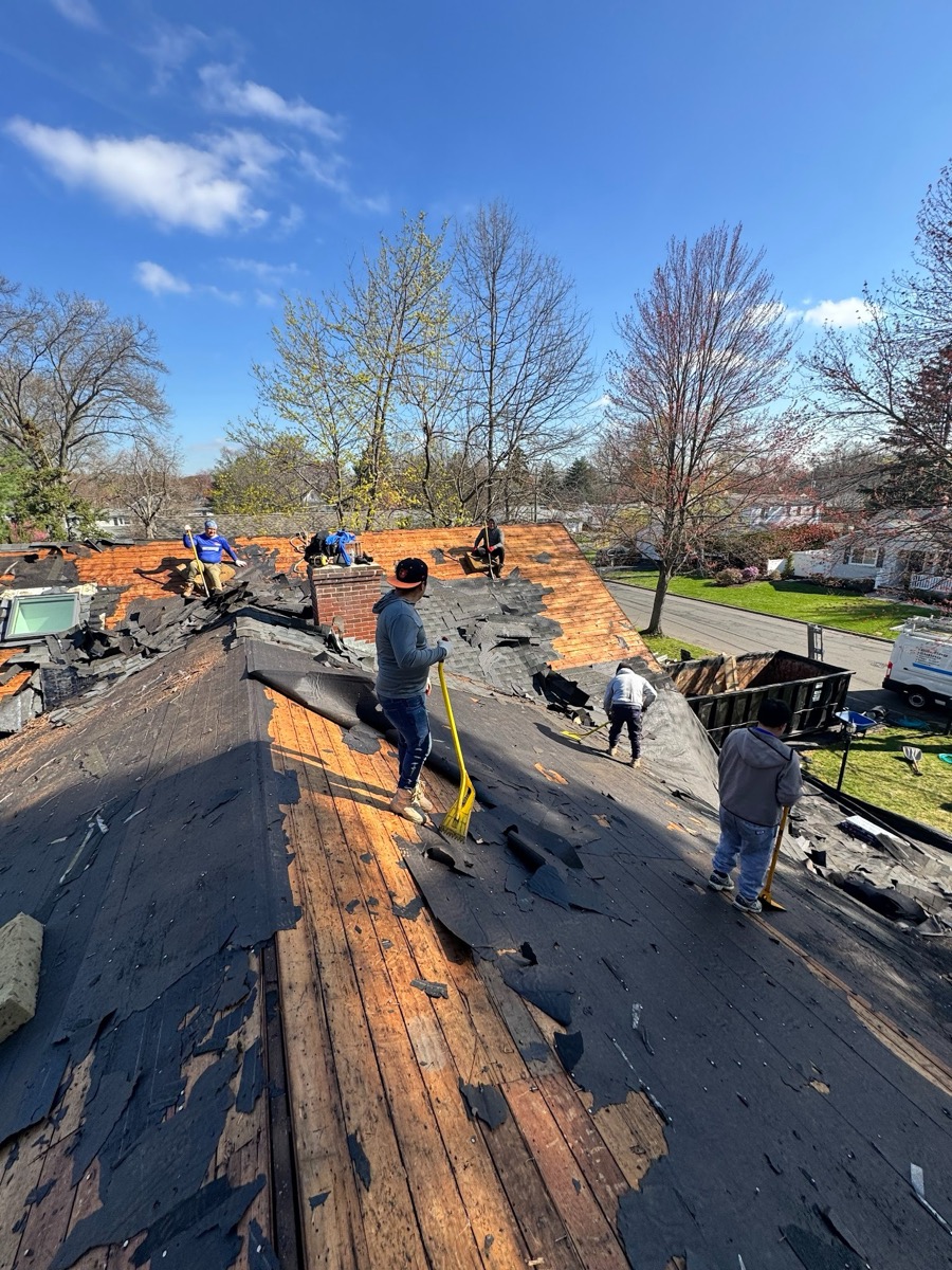 The All Elite Roofing & Siding crew removing an old roof on a New Jersey home